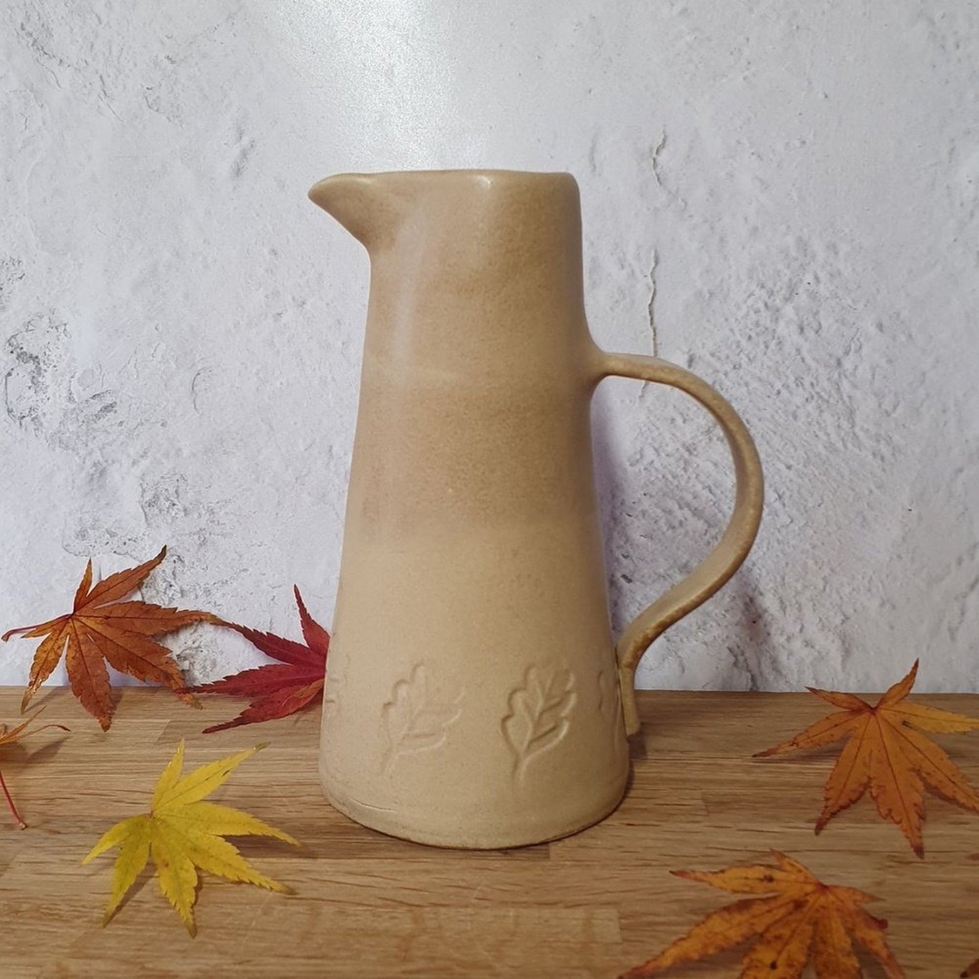 Handmade pottery pitcher jug/vase beige with leaf motif _image
