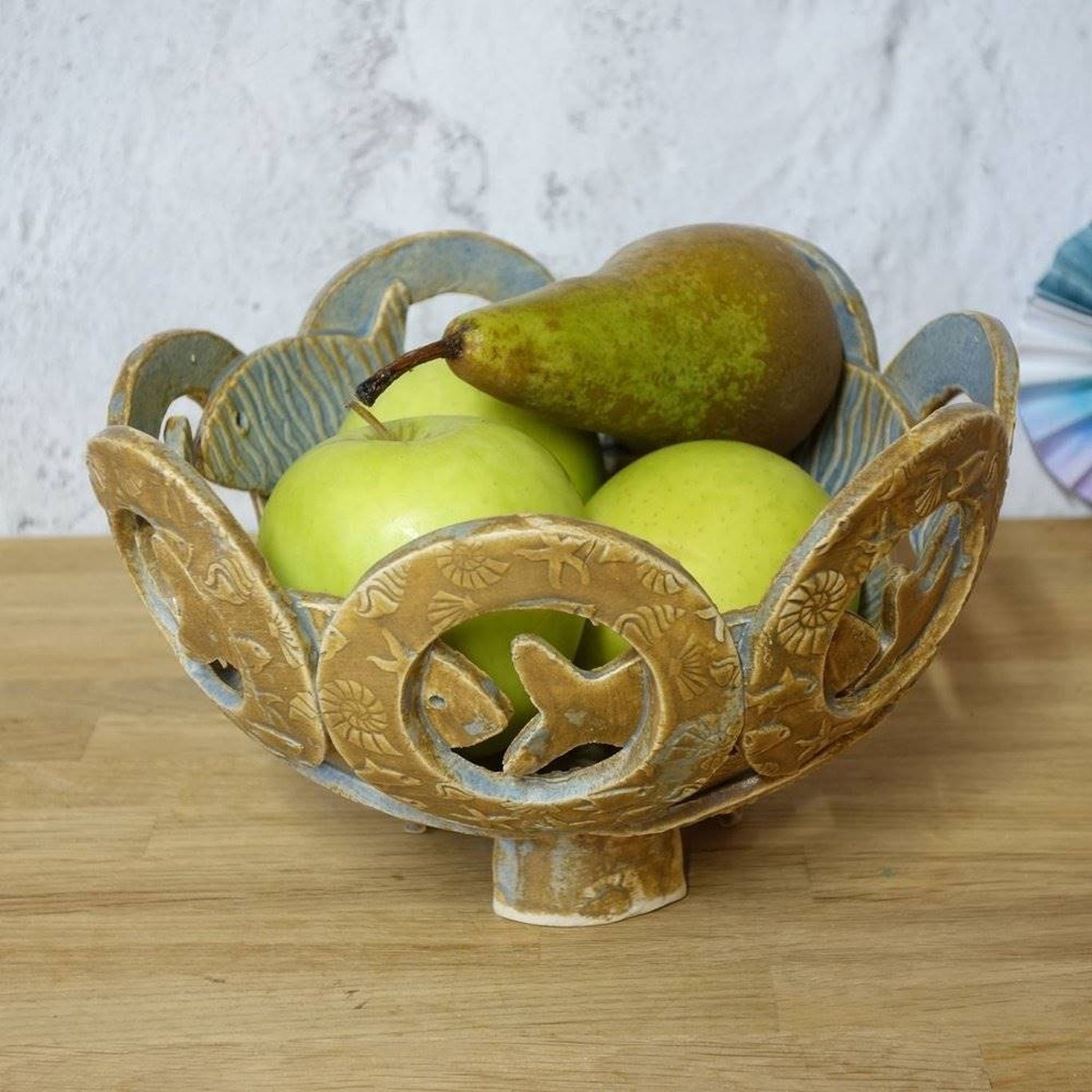 Sculptural handmade pottery fruit bowl with sealife _image