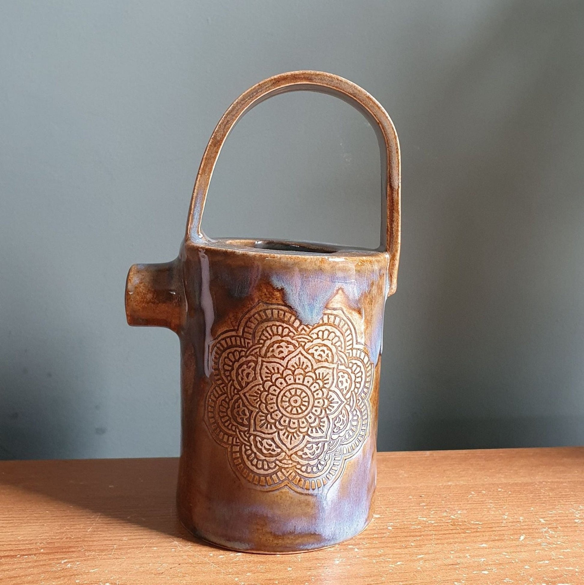 Rustic Stoneware Pourer with unique mandala relief _image