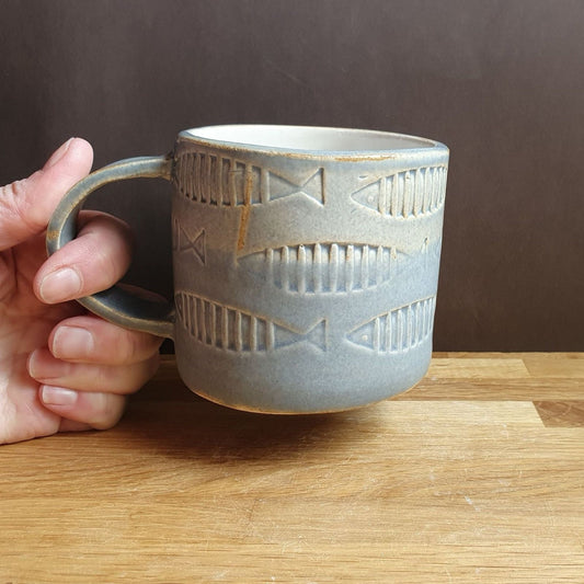 Mug with blue fish pattern handmade stoneware